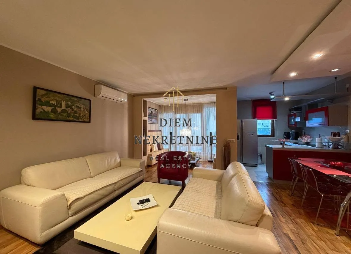 Spacious living room connected to the dining area and kitchen.