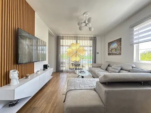 Modern and bright living room with a sofa and TV unit. - image 8