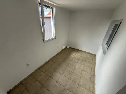 Empty room with ceramic tiled floor and two windows. - image 8