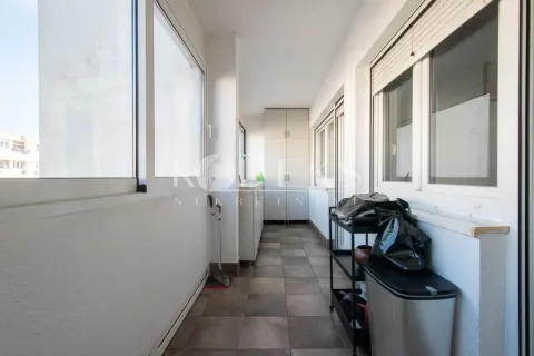Enclosed balcony with tiled floors and built-in cabinets. - image 3