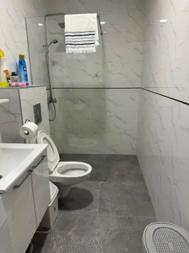 Modern bathroom equipped with a shower cabin and sanitary fixtures. - image 7