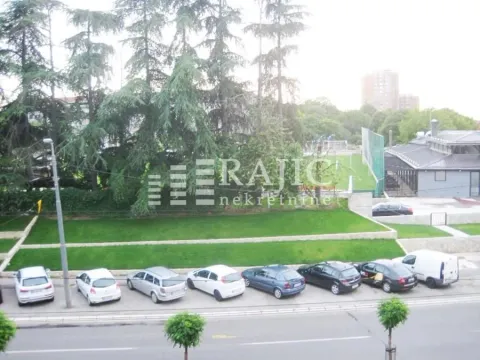 View from the terrace overlooking the yard and surrounding area with parked cars. - image 9