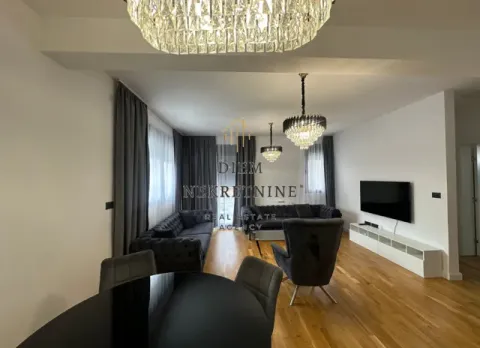 Living room with sofa set, dining table and modern lighting. - image 3