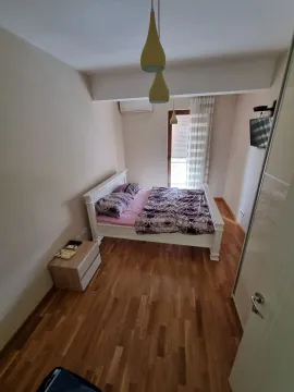 Simple bedroom with a double bed. - image 3