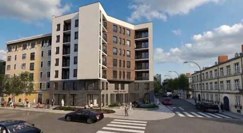 Exterior view of a modern residential building with a landscaped street and surrounding structures. - image 4