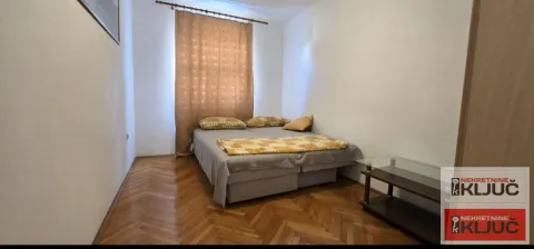Bedroom with a double bed and parquet flooring. - image 29