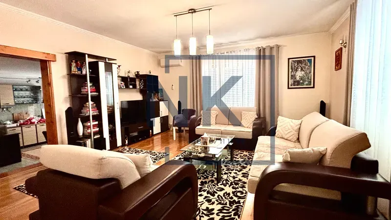 Furnished living room with a sofa set, coffee table, and TV.