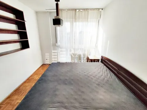 Bedroom with a double bed and a window. - image 11