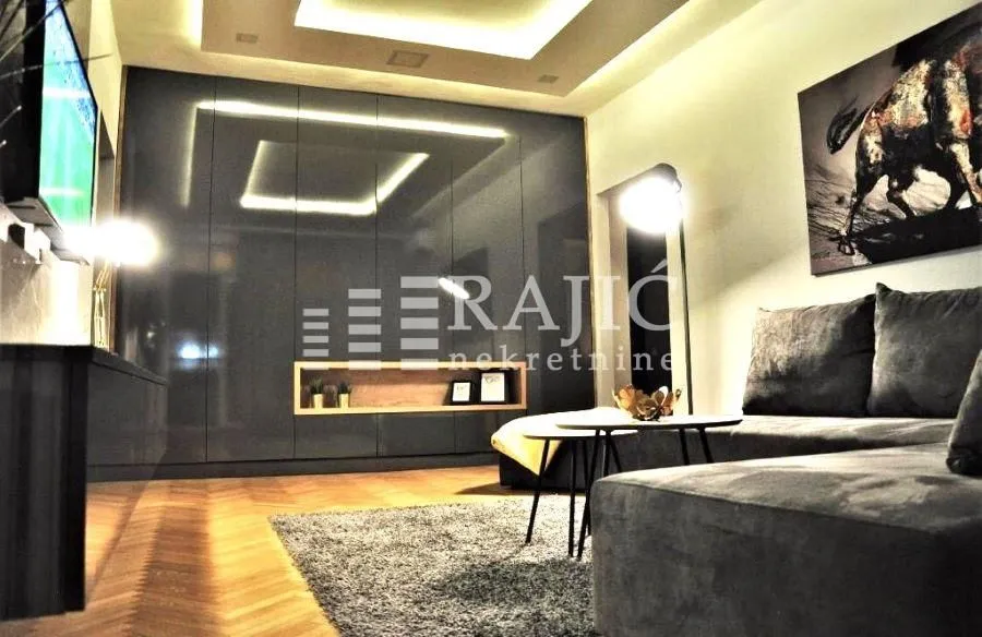 Modern living room with a sofa and built-in wardrobe.
