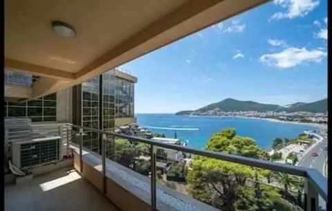 Terrace with a view of the sea and coastline. - image 2