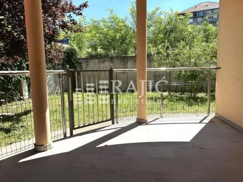 Covered terrace with a view of the yard and greenery. - image 7