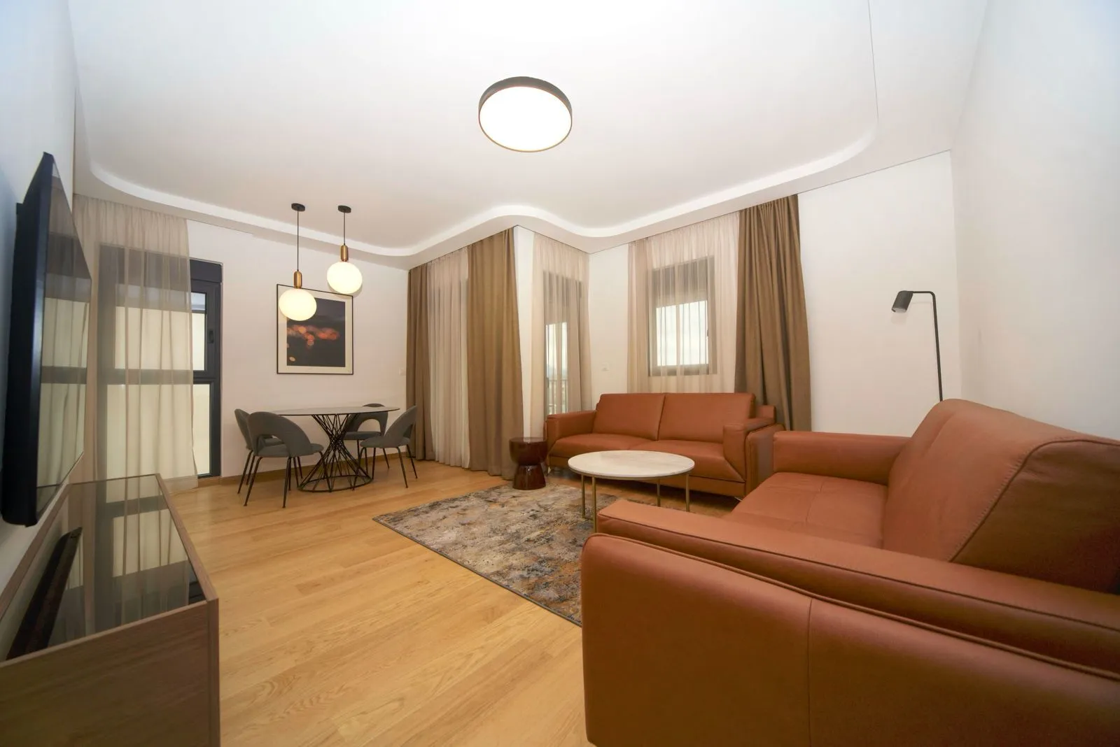 Spacious living room with a sofa set and dining area.
