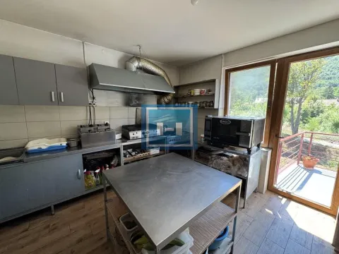 Commercial kitchen with stainless steel work elements and access to the terrace. - image 4