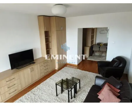Living room with sofa, television, and built-in closets. - image 3