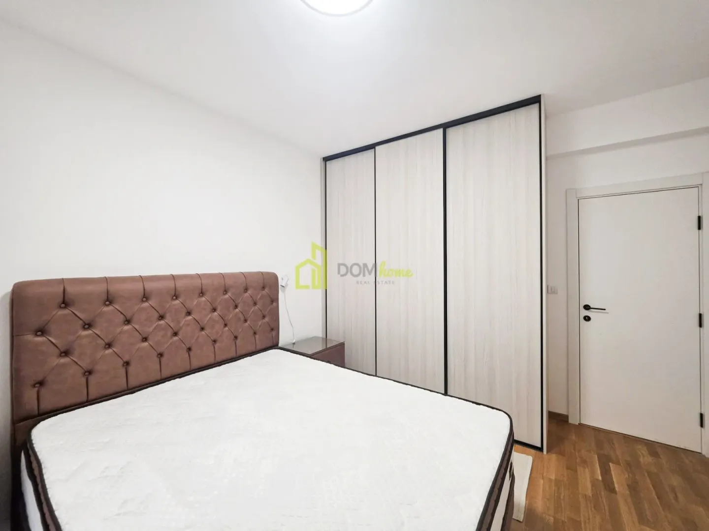 Bedroom with a double bed and a fitted wardrobe.