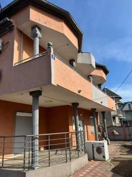Exterior view of the house with a balcony and columns. - image 2