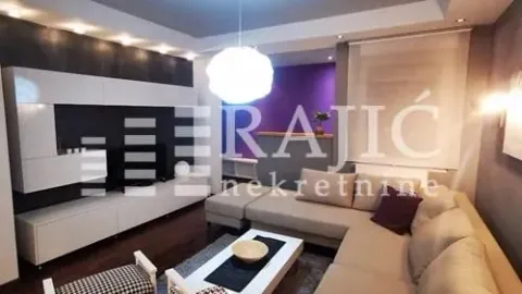 Living room with a sofa set and a TV unit. - image 3