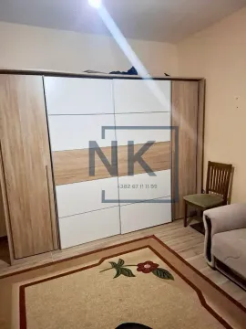 Bedroom with a large wardrobe, bed, and a rug. - image 7