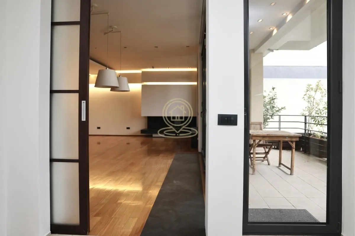 View from the hallway into the living room and terrace.