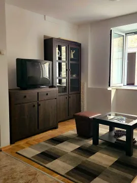 Living room with furniture, chest of drawers, display cabinet, and a window. - image 5