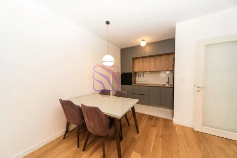 Small kitchen with a dining table and chairs. - image 4