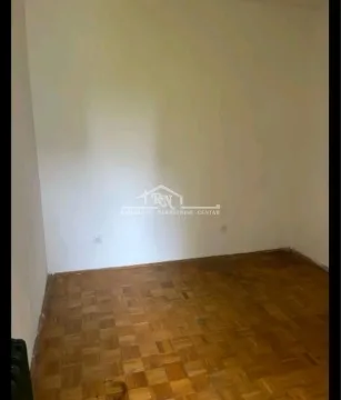 Empty room with hardwood parquet flooring. - image 7