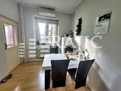 Dining area with a table, chairs, and window. - image 5