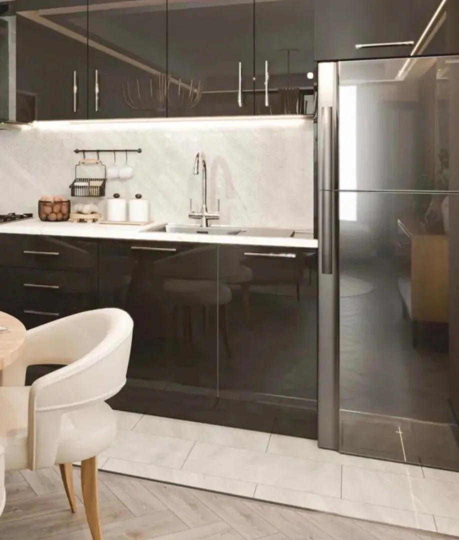 Modern kitchen with dark cabinets and a built-in refrigerator.