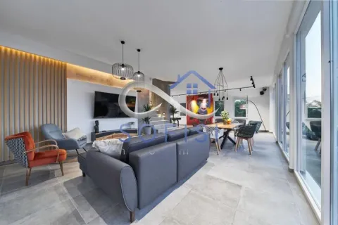 Spacious living room with a dining area and modern furniture. - image 2