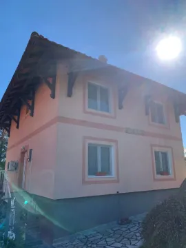 Exterior view of the house with a yard and sunny weather. - image 5