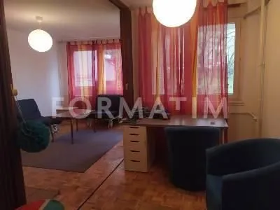 Living room with a desk and furniture. - image 2