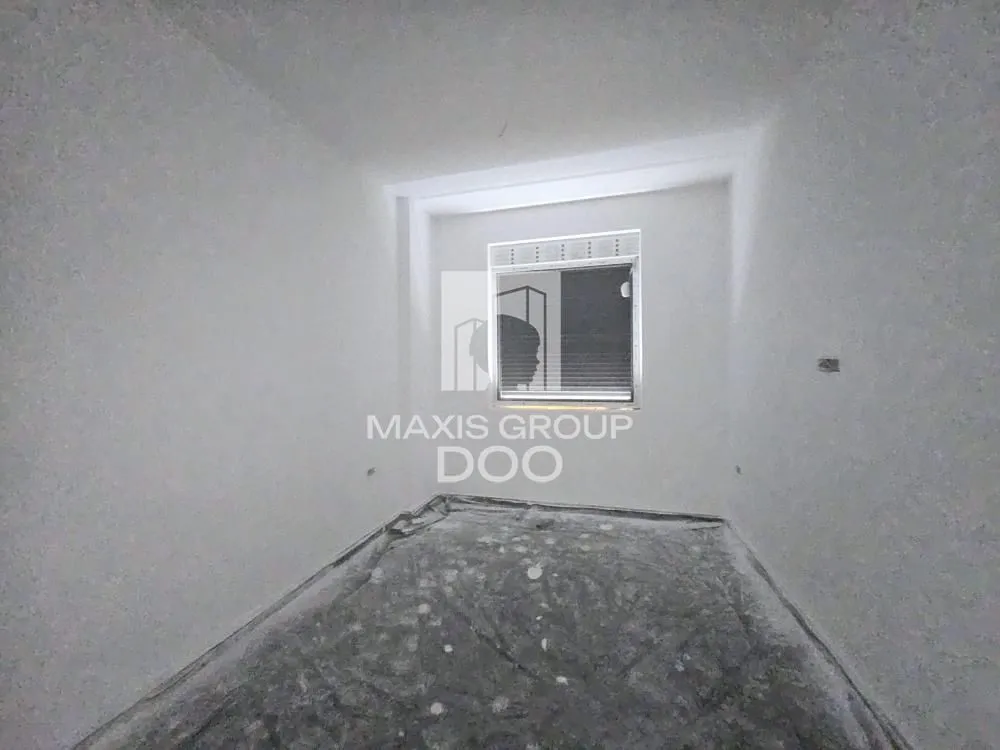 Empty unfurnished room with white walls and a window.