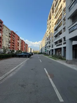 View of the street and residential buildings with parking. - image 2