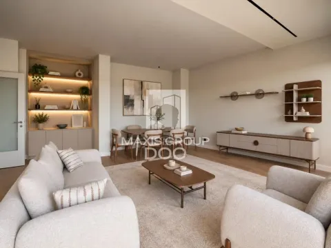Living room with a sofa, coffee table and dining area in the background. - image 3