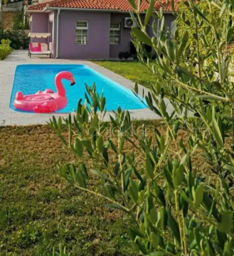 Yard of the house with a swimming pool and lawn. - image 2