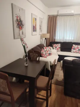 Bright living room with a dining table and comfortable seating. - image 5