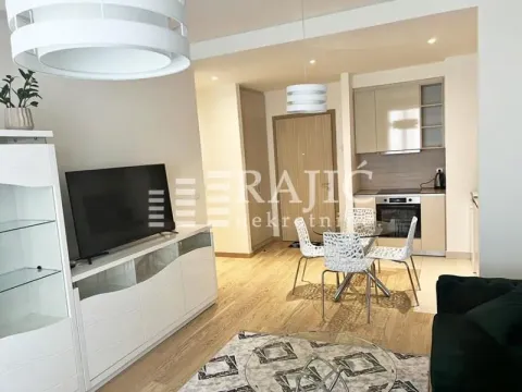 Modern living room with dining area and kitchen in the background. - image 2
