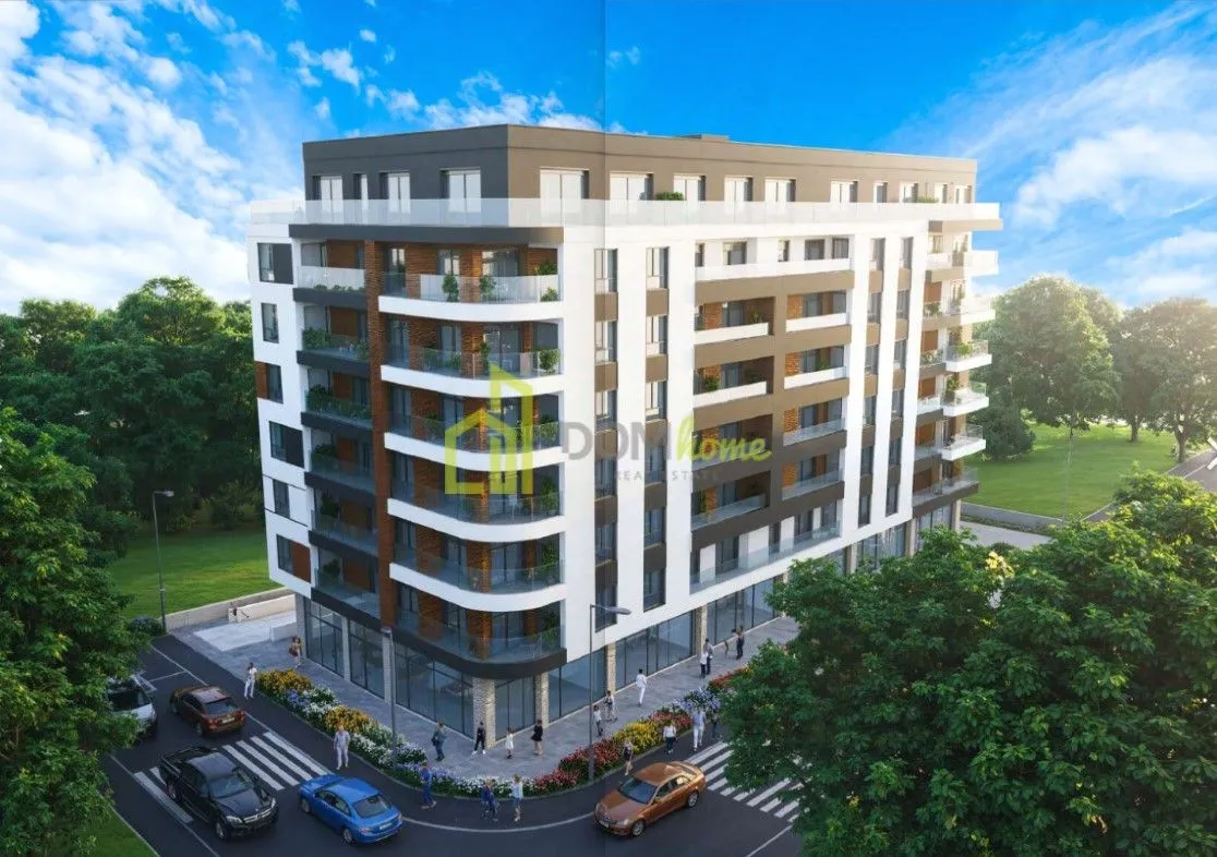 Exterior view of a modern residential building with balconies and surrounding area.