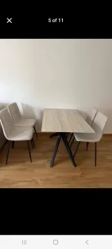 Trpezarijski sto sa četiri stolice u svijetloj prostoriji. - image 4