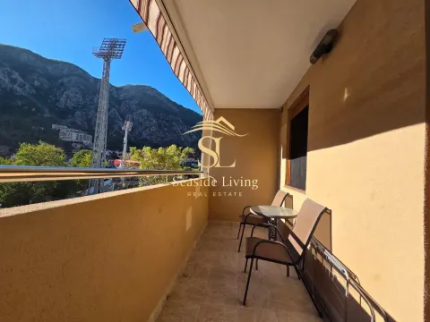 Furnished balcony with seating and mountain views. - image 13