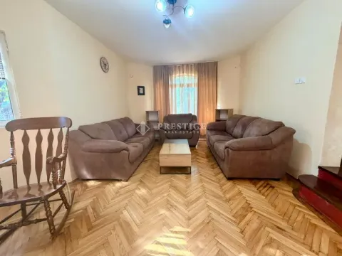 Spacious living room with a seating set and wooden parquet flooring. - image 8