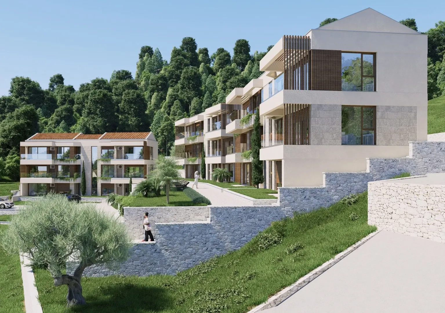 Spoljašnji izgled modernih stambenih zgrada sa uređenim dvorištem.
