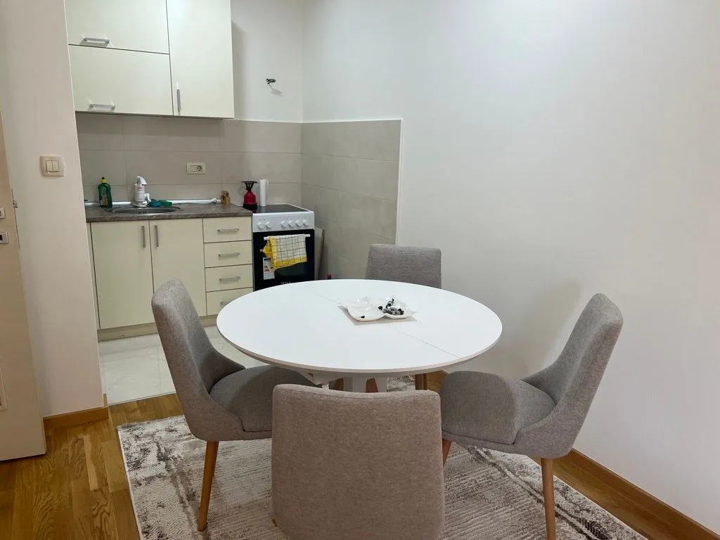Smaller kitchen with a dining table and four chairs.
