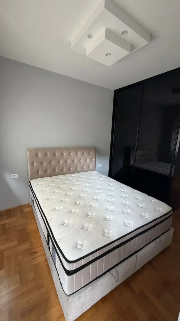 Bedroom with a double bed and a fitted wardrobe.