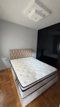 Bedroom with a double bed and a fitted wardrobe. - image 6