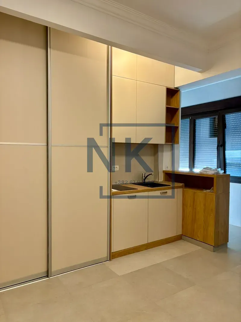 Smaller kitchen with built-in units and sink.