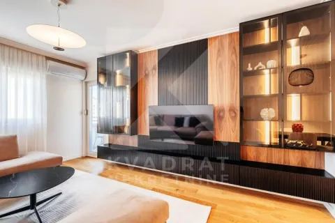 Living room with modern furniture and a TV wall unit with display cabinets. - image 5