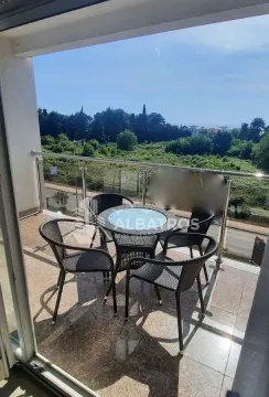 Furnished terrace with seating set and green surroundings view. - image 13