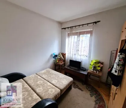 Smaller bedroom with a pull-out bed and a window. - image 6