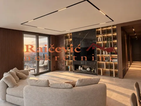 Living room with a sofa, built-in shelving, and access to a terrace with a view. - image 9